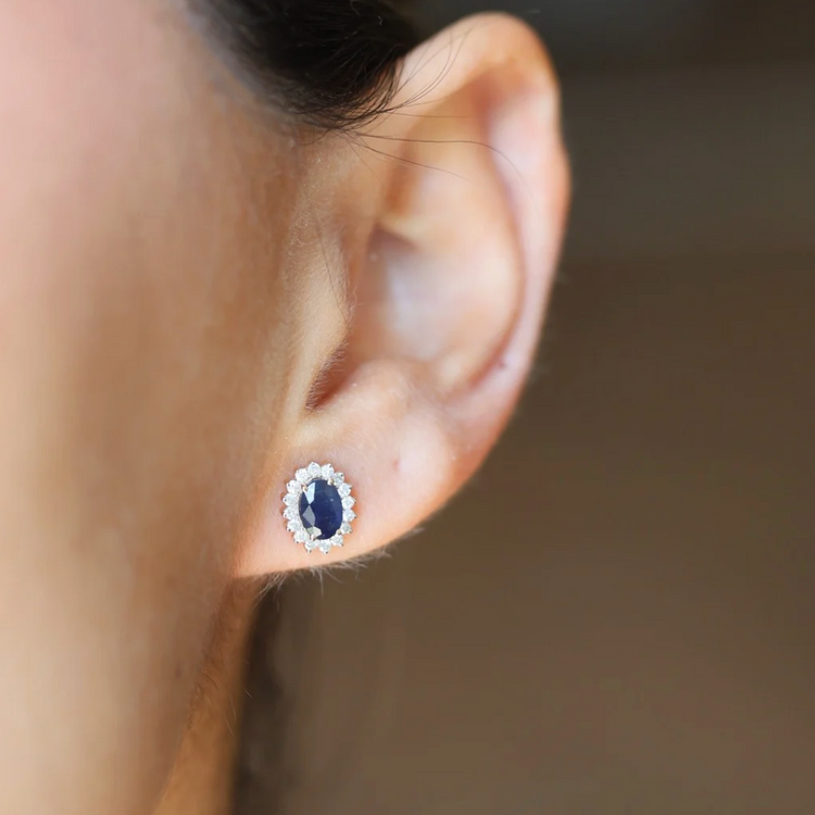 Blue sapphire earrings with a diamond halo